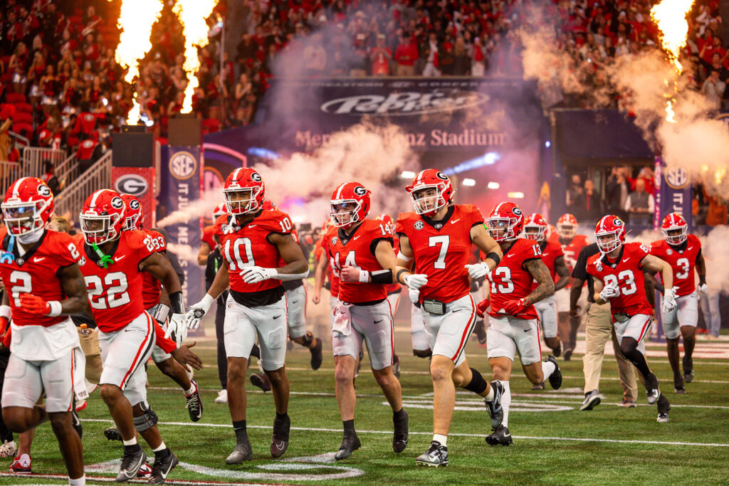 UGA football players on the field during a game in Athens, Georgia